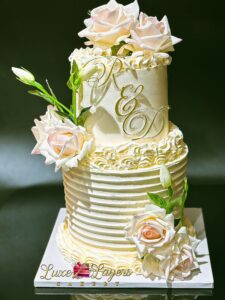 Custom vanilla floral wedding cake elegant tiered design Miami — Luxe Layers Cakery