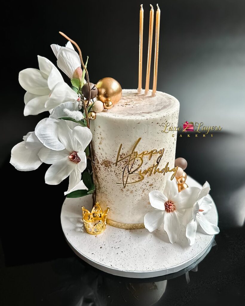 Elegant floral buttercream birthday cake with gold accents by Luxe Layers Cakery Miami