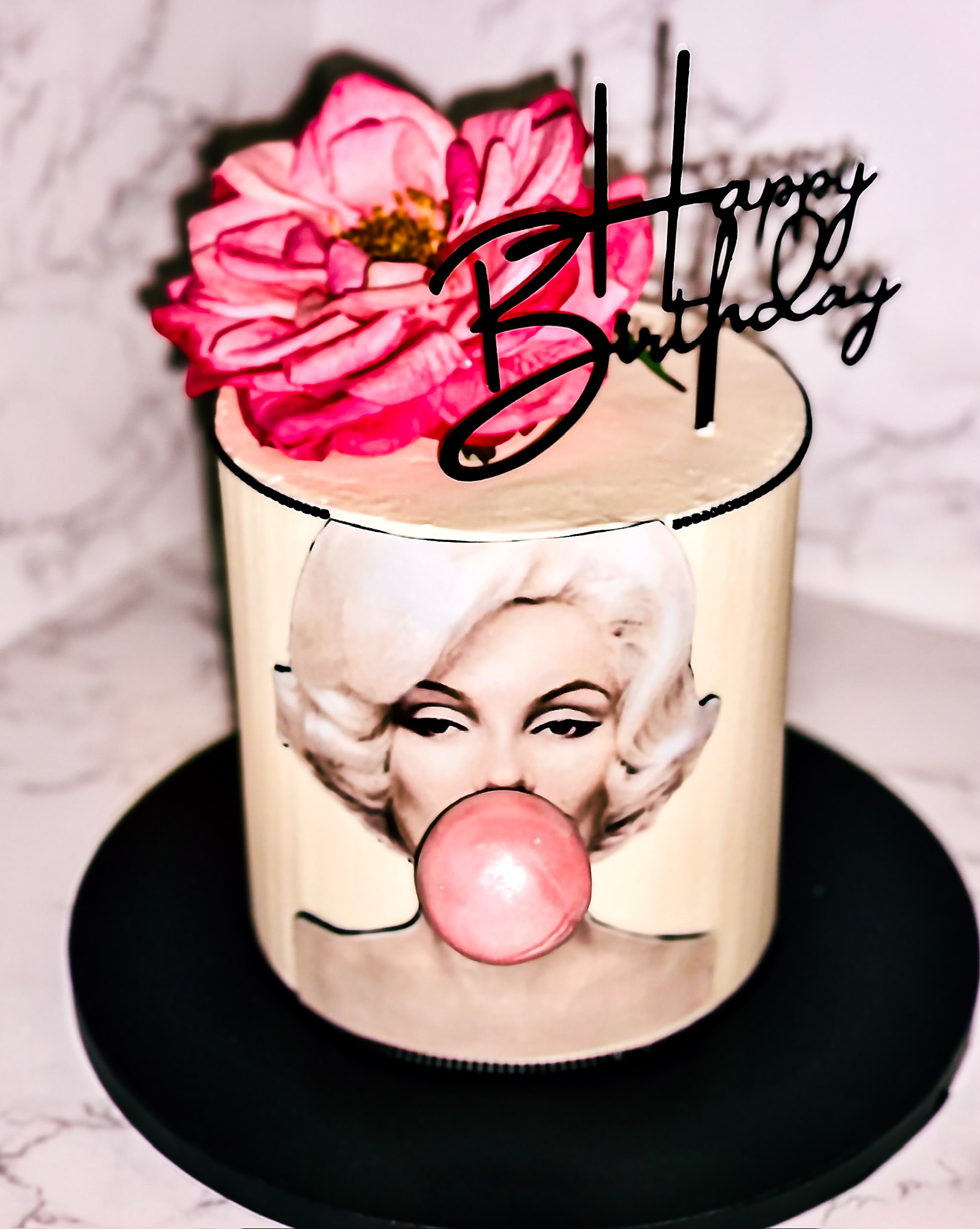 Single-tier glam pop art birthday cake with custom edible image centerpiece, sculpted bubblegum detail, floral topper, and modern script topper — custom birthday cakes in Miami by Luxe Layers Cakery