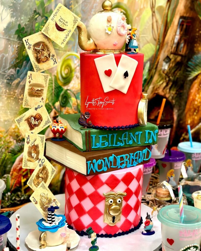 Two tier Alice in Wonderland themed birthday cake with playing cards and teapot design made by Luxe Layers Cakery in Miami Florida