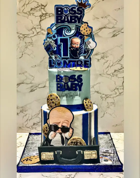 Boss Baby-themed vanilla birthday cake with fondant character and baby suit accents — kids birthday cakes Miami by Luxe Layers Cakery