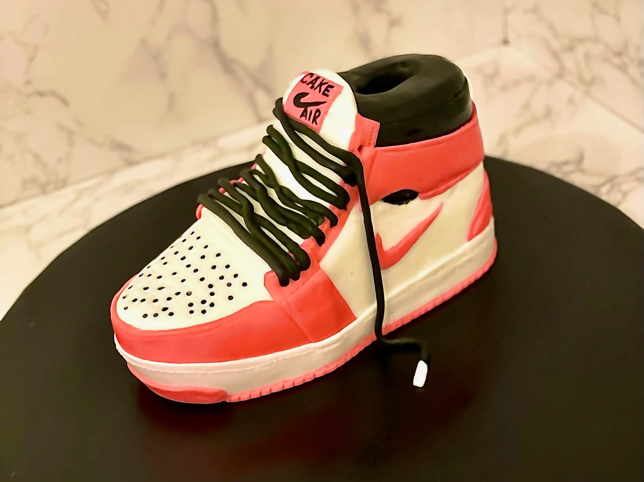 Pink and white sculpted sneaker birthday cake with hand-crafted fondant shoe design — kids birthday cakes Miami by Luxe Layers Cakery