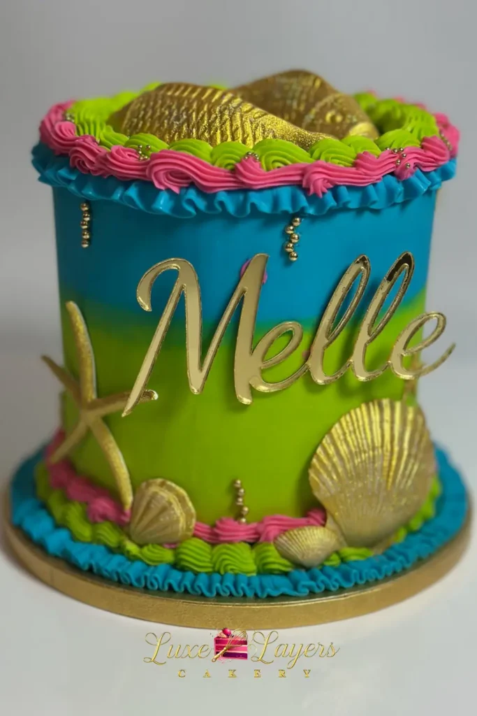 Teal, pink, and gold tropical Pisces zodiac birthday cake with floral and star accents — kids birthday cakes Miami by Luxe Layers Cakery