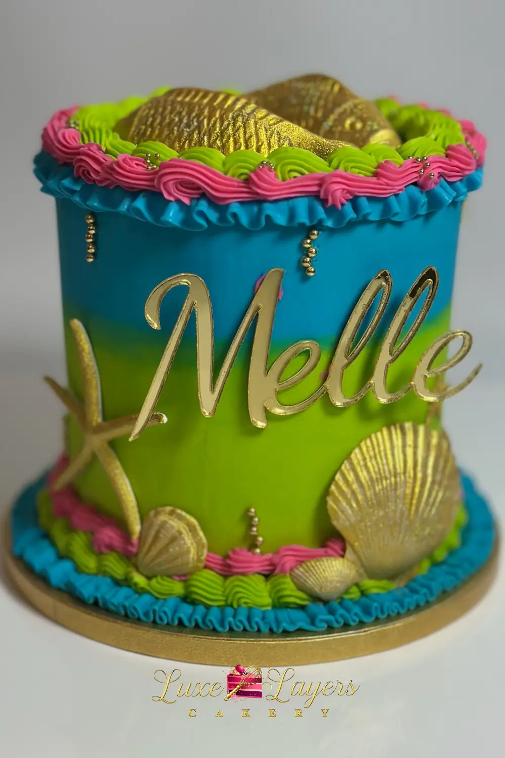 Teal, pink, and gold tropical Pisces zodiac birthday cake with floral and star accents — kids birthday cakes Miami by Luxe Layers Cakery