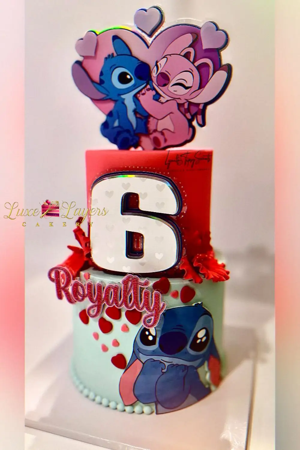 Two-tier character-themed 6th birthday cake with colorful fondant character accents — kids birthday cakes Miami by Luxe Layers Cakery