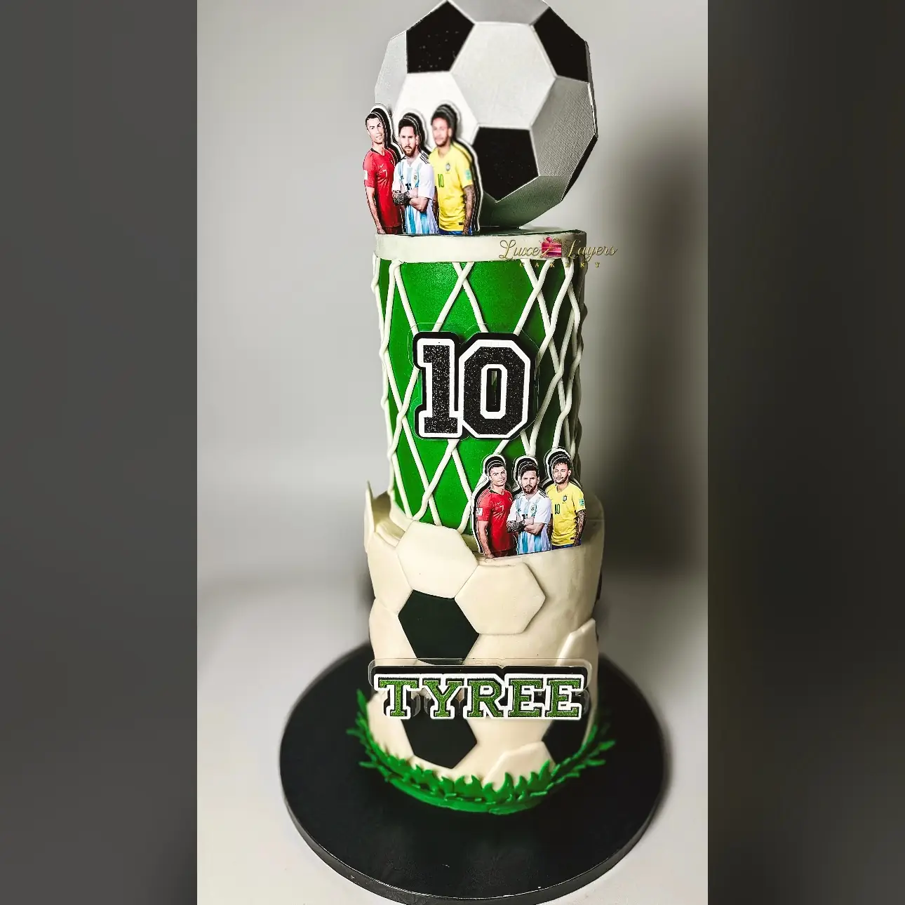 Two-tier soccer-themed birthday cake with fondant soccer ball and field accents — kids birthday cakes Miami by Luxe Layers Cakery