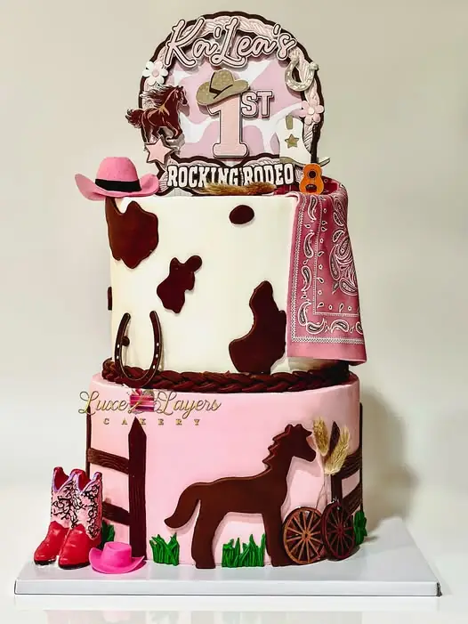 Western-themed fondant first birthday cake with cowboy boot and hat accents — kids birthday cakes Miami by Luxe Layers Cakery