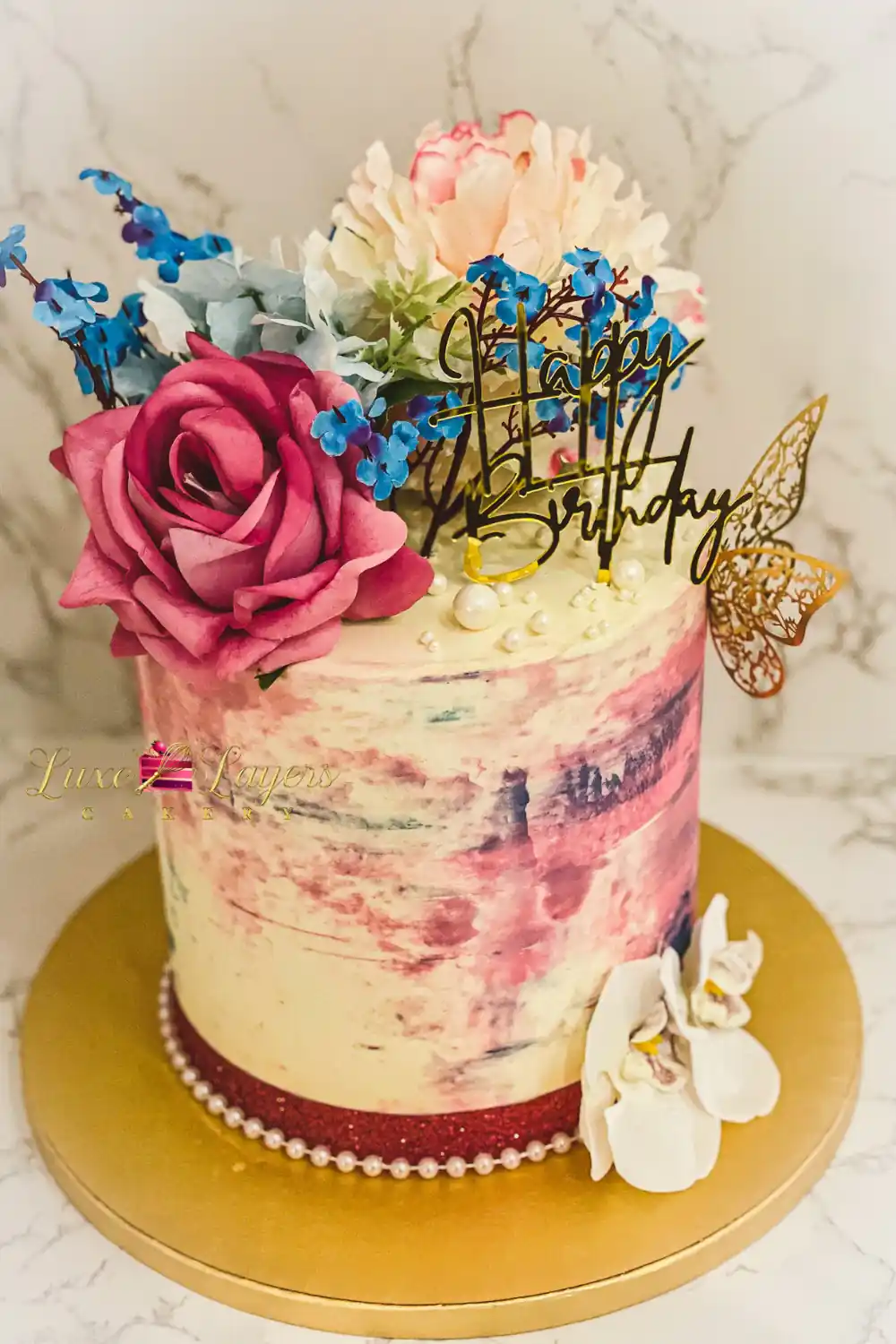 Strawberry floral painted buttercream birthday cake Miami with fresh roses and gold details by Luxe Layers Cakery