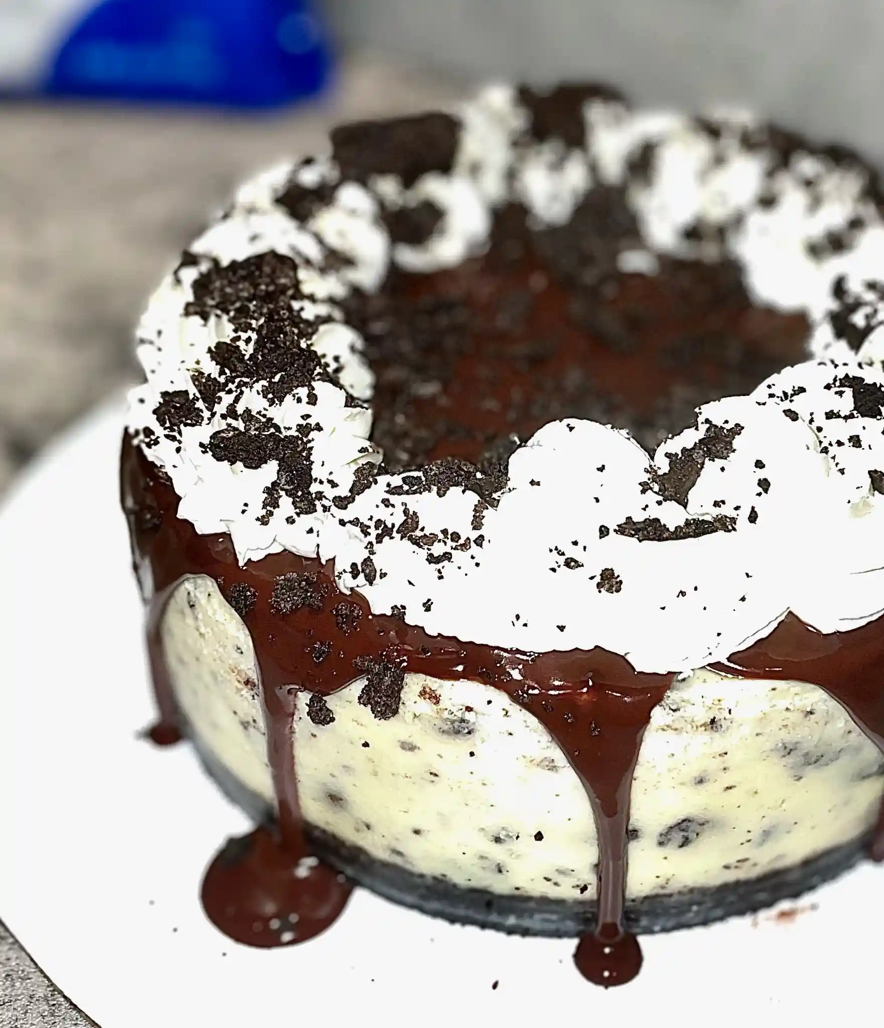 Custom chocolate ganache drip cake Miami with Oreo topping by Luxe Layers Cakery
