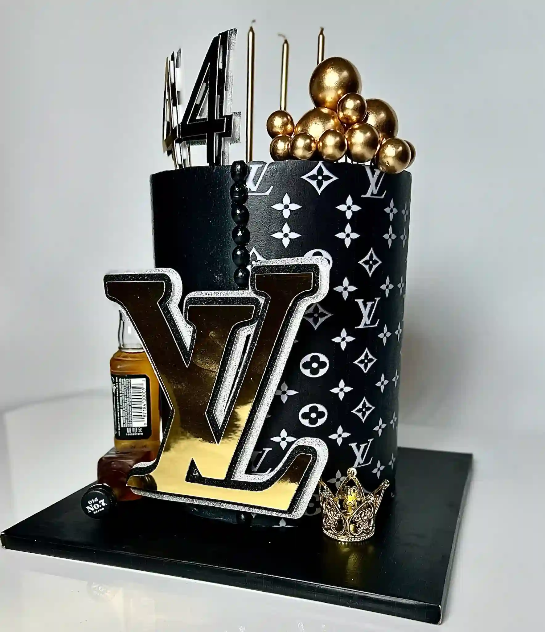 Custom luxury designer novelty birthday cake Miami in black and gold by Luxe Layers Cakery