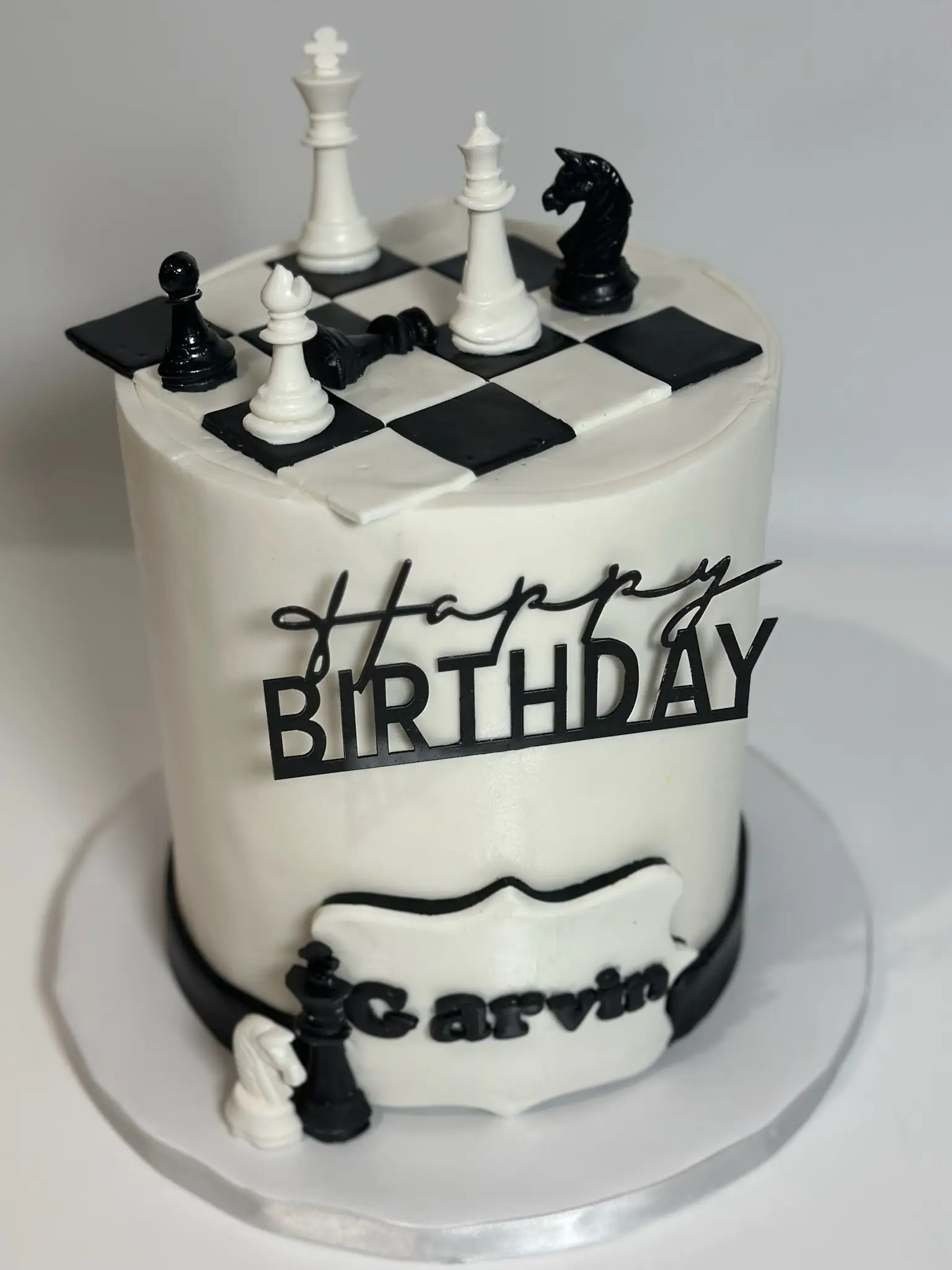 Modern black and white fondant birthday cake with chess piece design — custom cakes North Miami Beach FL by Luxe Layers Cakery