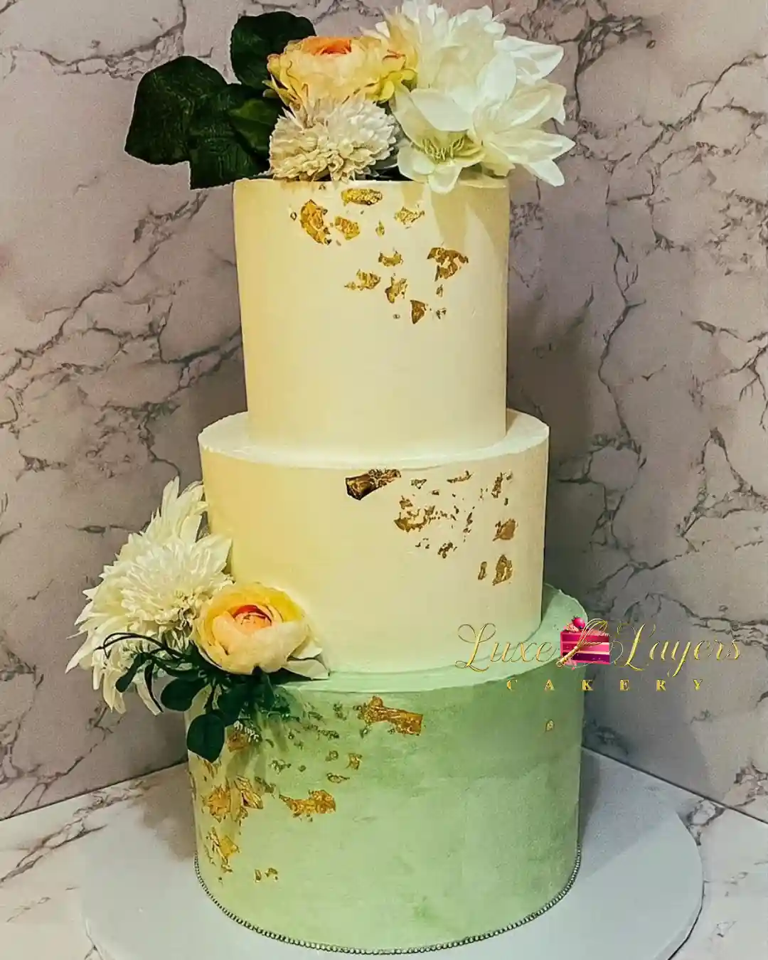 Three-tier ivory to sage green ombre cake with gold leaf accents and white and blush florals — quinceañera cake design North Miami Beach FL by Luxe Layers Cakery